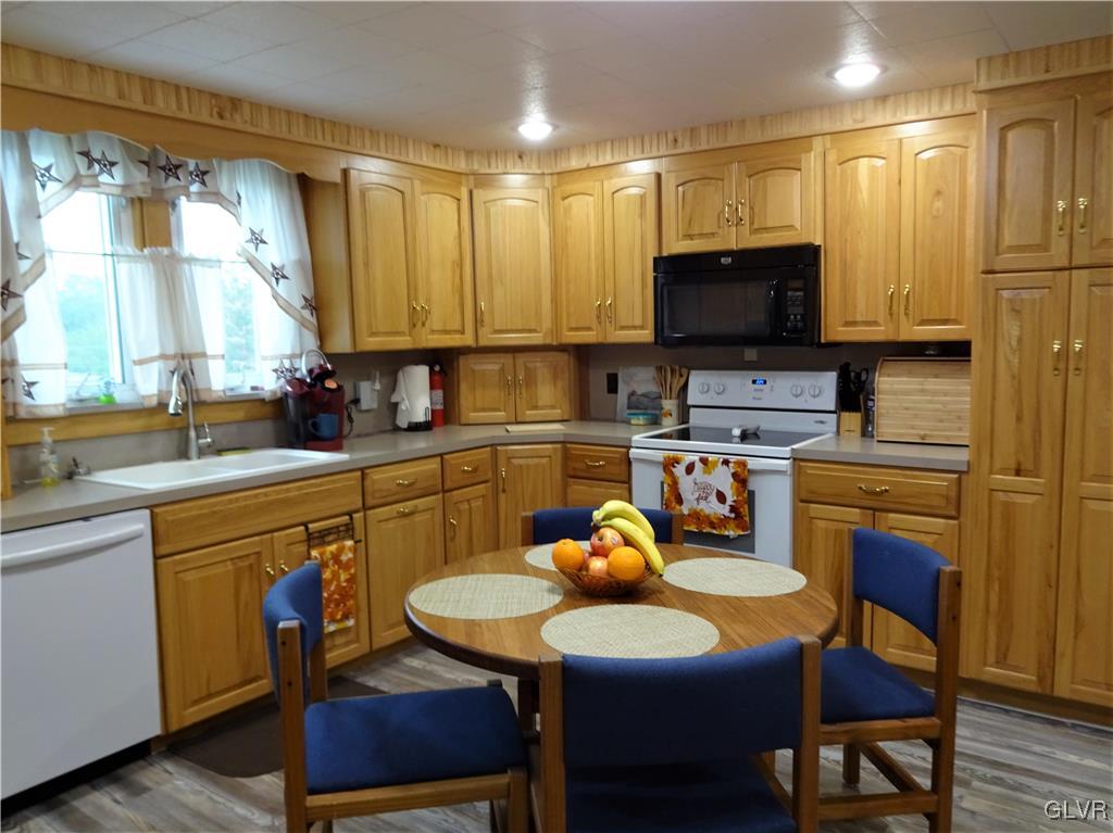 575 School Road Nazareth, PA 18064 - Photo 15 of 48 a kitchen with a dining table and chairs