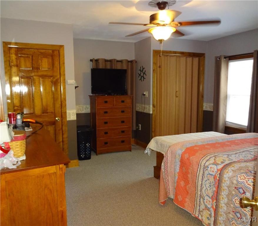 575 School Road Nazareth, PA 18064 - Photo 21 of 48 a bedroom with a bed and a television
