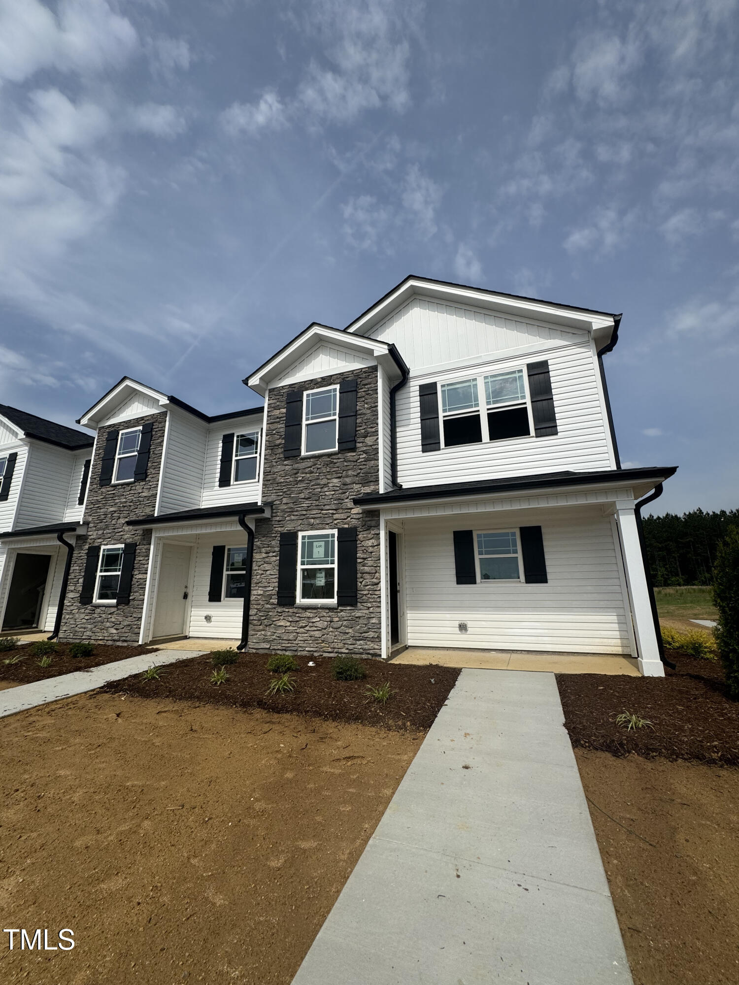 1101 Brookrun Drive Oxford, NC 27565 - Photo 1 of 32 a front view of a house with a yard