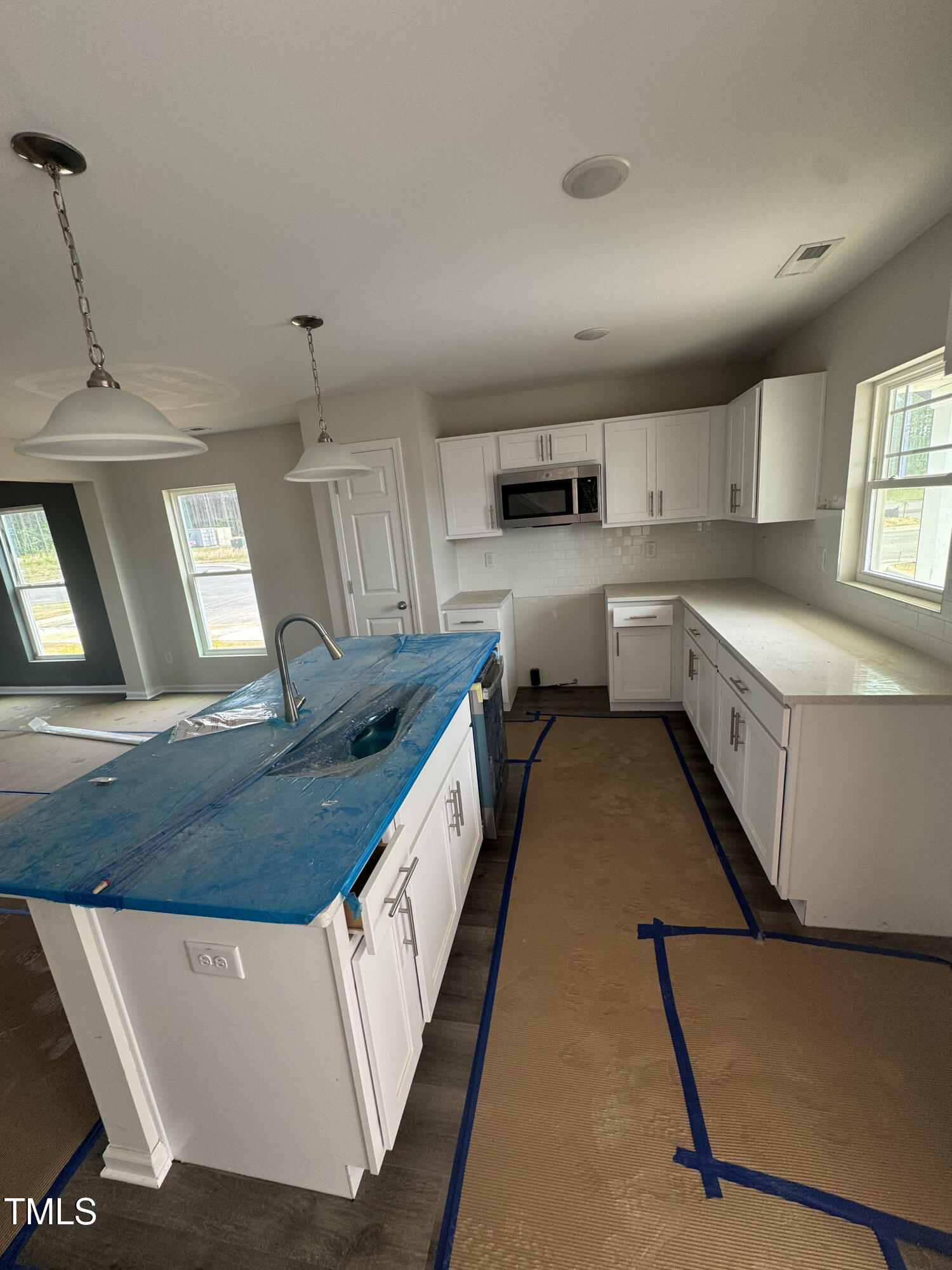 1101 Brookrun Drive Oxford, NC 27565 - Photo 4 of 32 a kitchen with kitchen island granite countertop lots of counter top space and stainless steel appliances