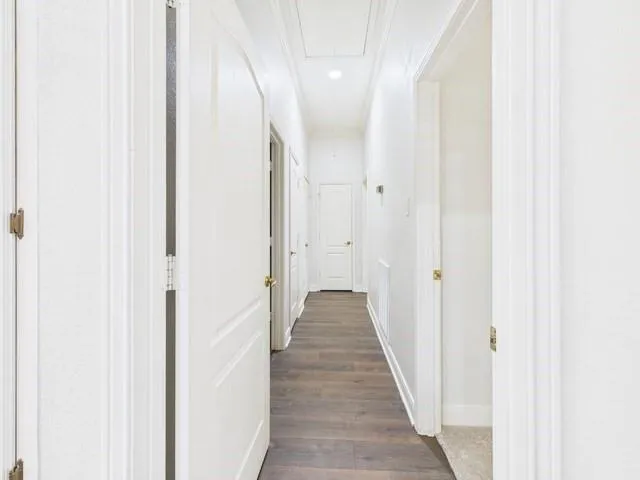 a view of a room with a ceiling fan and a window