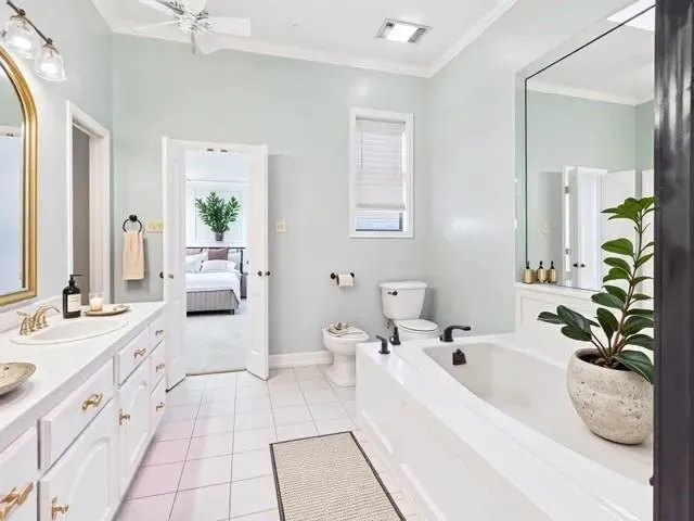 a living room with furniture potted plant and a chandelier