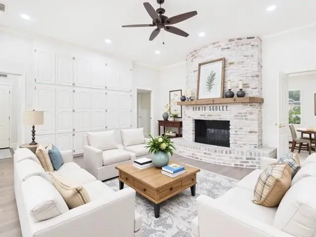 a view of a dining room with furniture and a chandelier