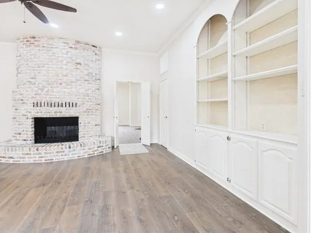 a view of an empty room with a fireplace