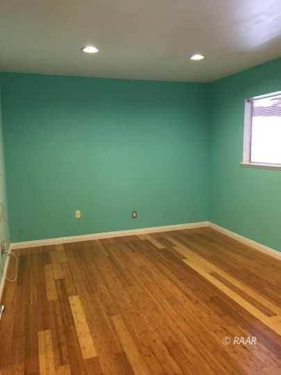 224 West Rader Avenue Ridgecrest, CA 93555 - Photo 17 of 26 a view of a room with wooden floor and windows