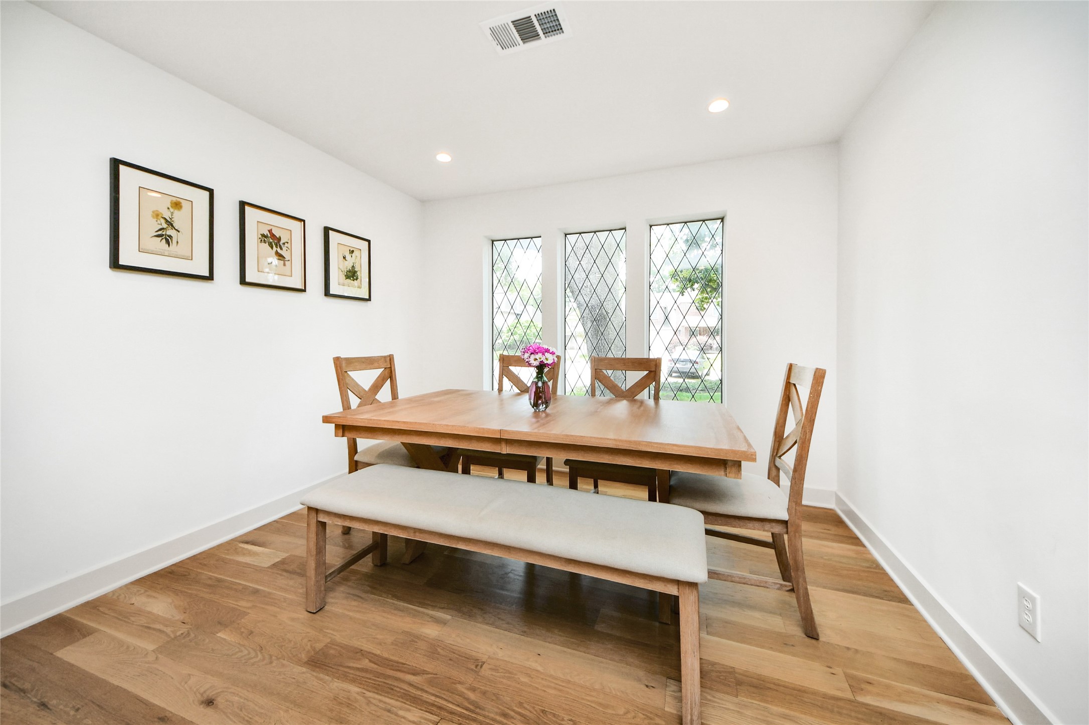 3030 Bernadette Lane Houston, TX 77043 - Photo 12 of 31 a view of a dining room with furniture window and wooden floor