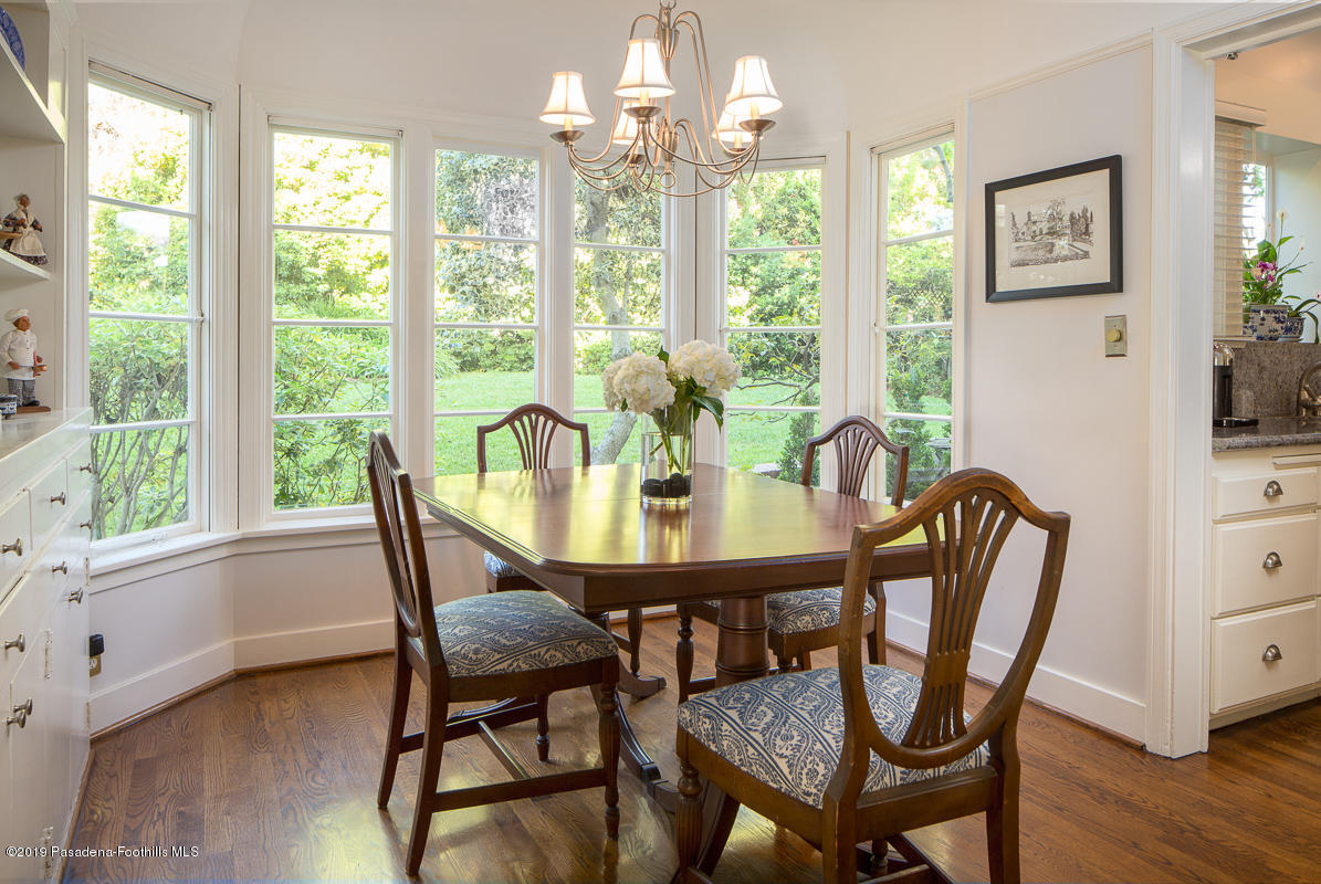 155 Club Road Pasadena, CA 91105 - Photo 18 of 50 a view of a dining room with furniture a chandelier and wooden floor