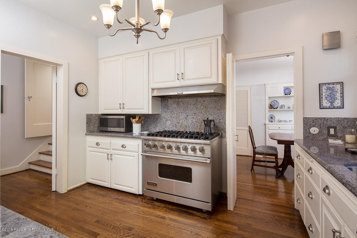 155 Club Road Pasadena, CA 91105 - Photo 23 of 50 a kitchen with cabinets appliances and wooden floor