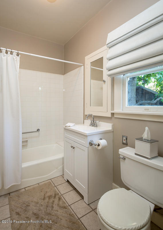 155 Club Road Pasadena, CA 91105 - Photo 28 of 50 a bathroom with a sink a toilet a mirror and a bathtub