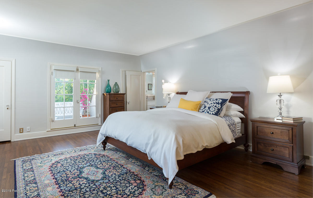 155 Club Road Pasadena, CA 91105 - Photo 31 of 50 a bedroom with a bed and wooden floor
