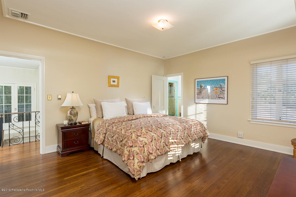155 Club Road Pasadena, CA 91105 - Photo 39 of 50 a bedroom with a bed and wooden floor