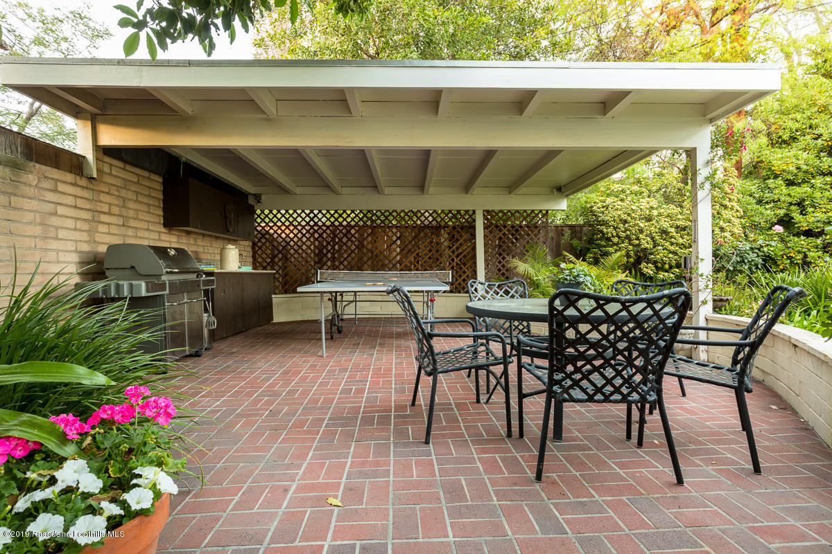 155 Club Road Pasadena, CA 91105 - Photo 47 of 50 a view of a patio with table and chairs potted plants with wooden floor