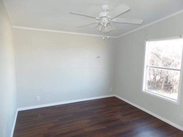 178 Valley Lake Lane Springtown, TX 76082 - Photo 14 of 25 a view of an empty room with wooden floor and a window