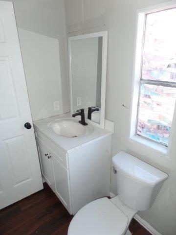 178 Valley Lake Lane Springtown, TX 76082 - Photo 16 of 25 a bathroom with a granite countertop toilet sink and mirror