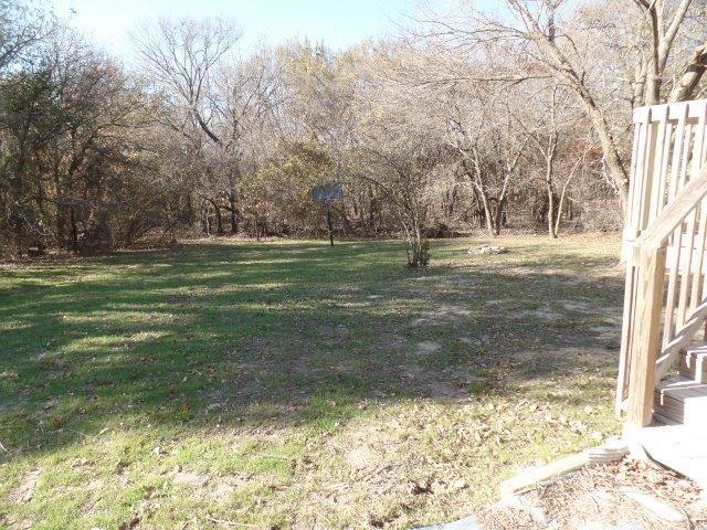 178 Valley Lake Lane Springtown, TX 76082 - Photo 22 of 25 a view of a yard with large trees
