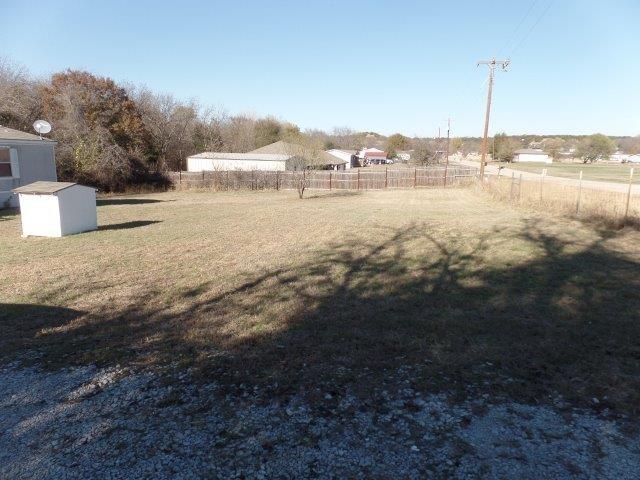 178 Valley Lake Lane Springtown, TX 76082 - Photo 23 of 25 a view of a lake with beach