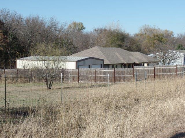 178 Valley Lake Lane Springtown, TX 76082 - Photo 24 of 25 a backyard of a house with lots of green space and lake view