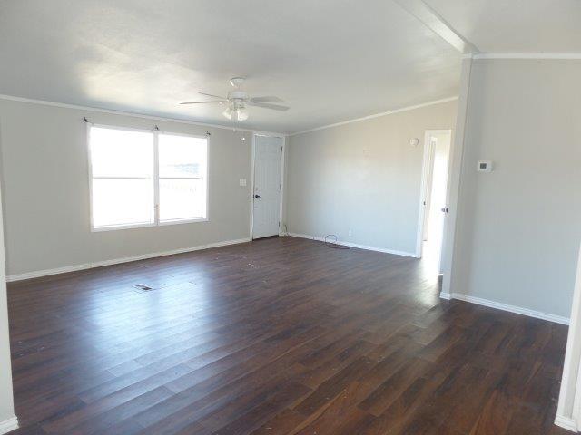 178 Valley Lake Lane Springtown, TX 76082 - Photo 6 of 25 an empty room with wooden floor and windows