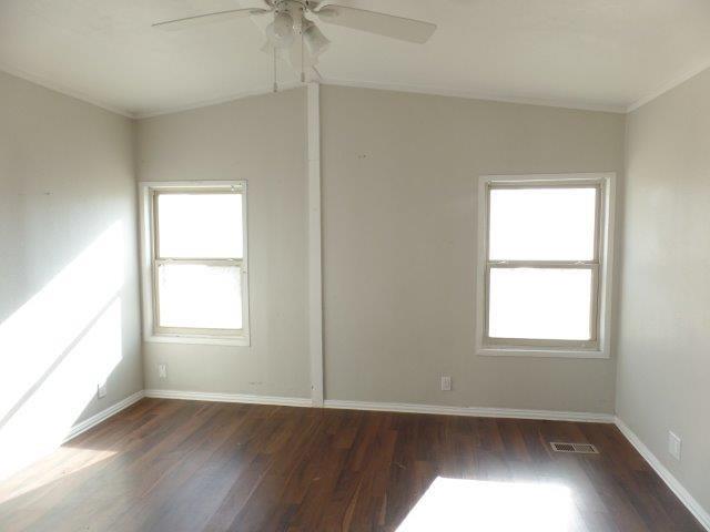 178 Valley Lake Lane Springtown, TX 76082 - Photo 10 of 25 an empty room with wooden floor and windows