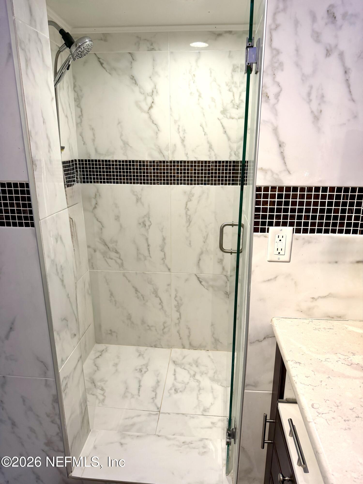4127 Springwood Road Jacksonville, FL 32207 - Photo 33 of 63 a bathroom with a bathtub and shower