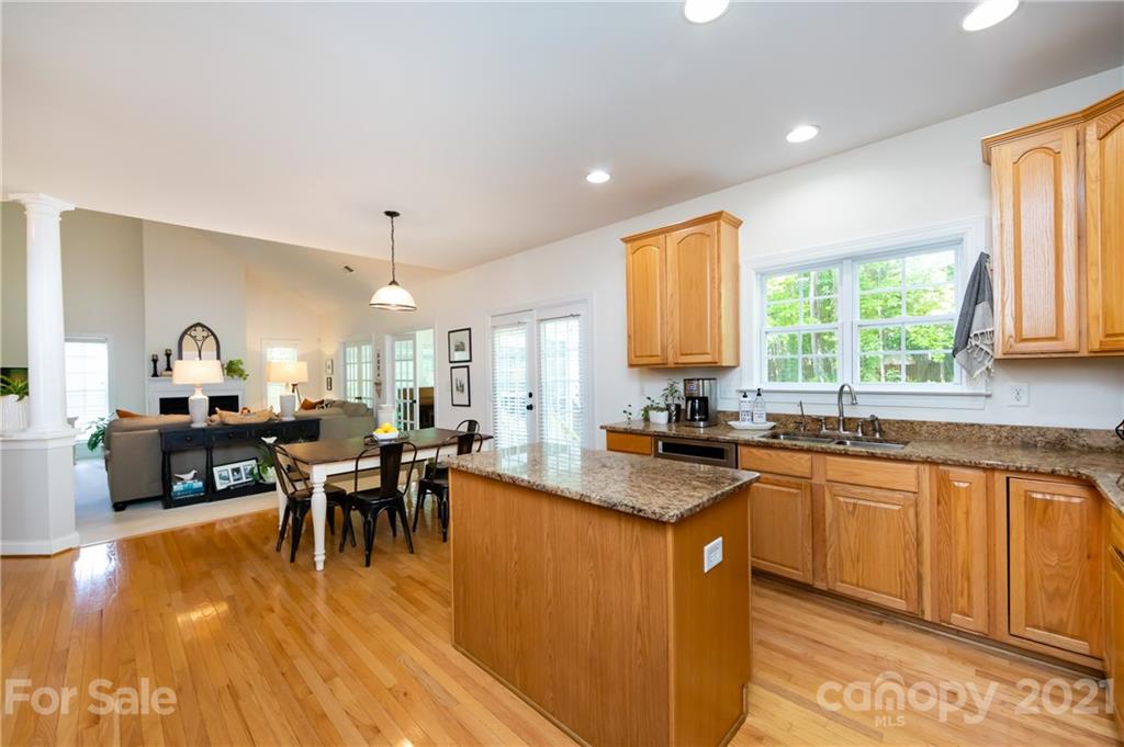 2320 Blueberry Ridge Road Matthews, NC 28105 - Photo 8 of 30 a kitchen with lots of counter top space and dining table