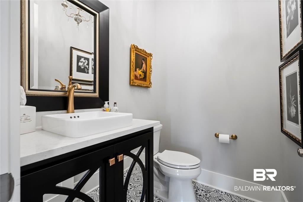 707 Cardamel Court Fairhope, AL 36532 - Photo 16 of 40 Bathroom featuring vanity, tile patterned flooring, and toilet