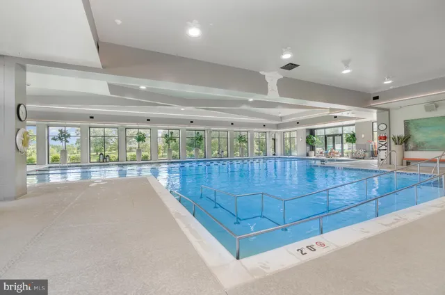 a view of a swimming pool with outdoor seating space