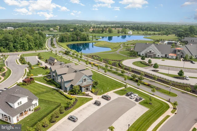 an aerial view of a house with a big yard