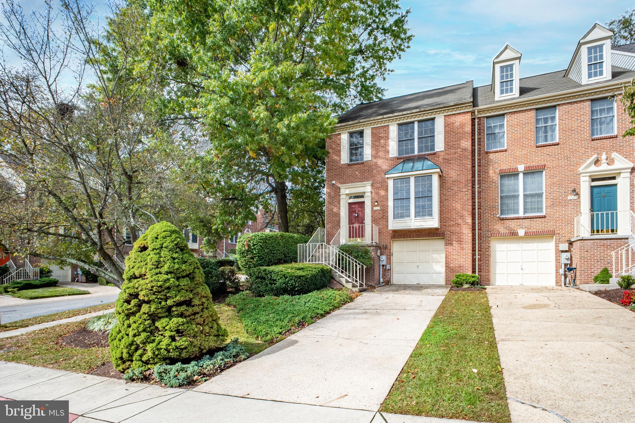 5522 April Journey, Unit 11 Columbia, MD 21044 - Photo 2 of 34 a front view of a house with garden