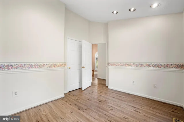 a view of a room with wooden floor