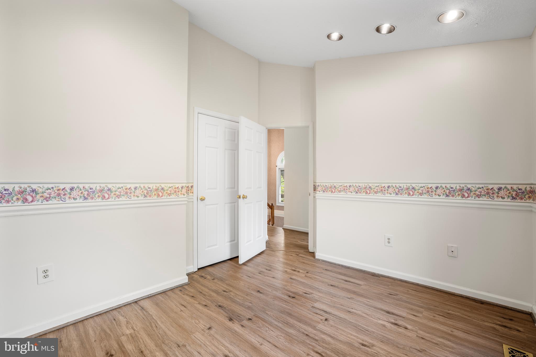5522 April Journey, Unit 11 Columbia, MD 21044 - Photo 24 of 34 a view of a room with wooden floor