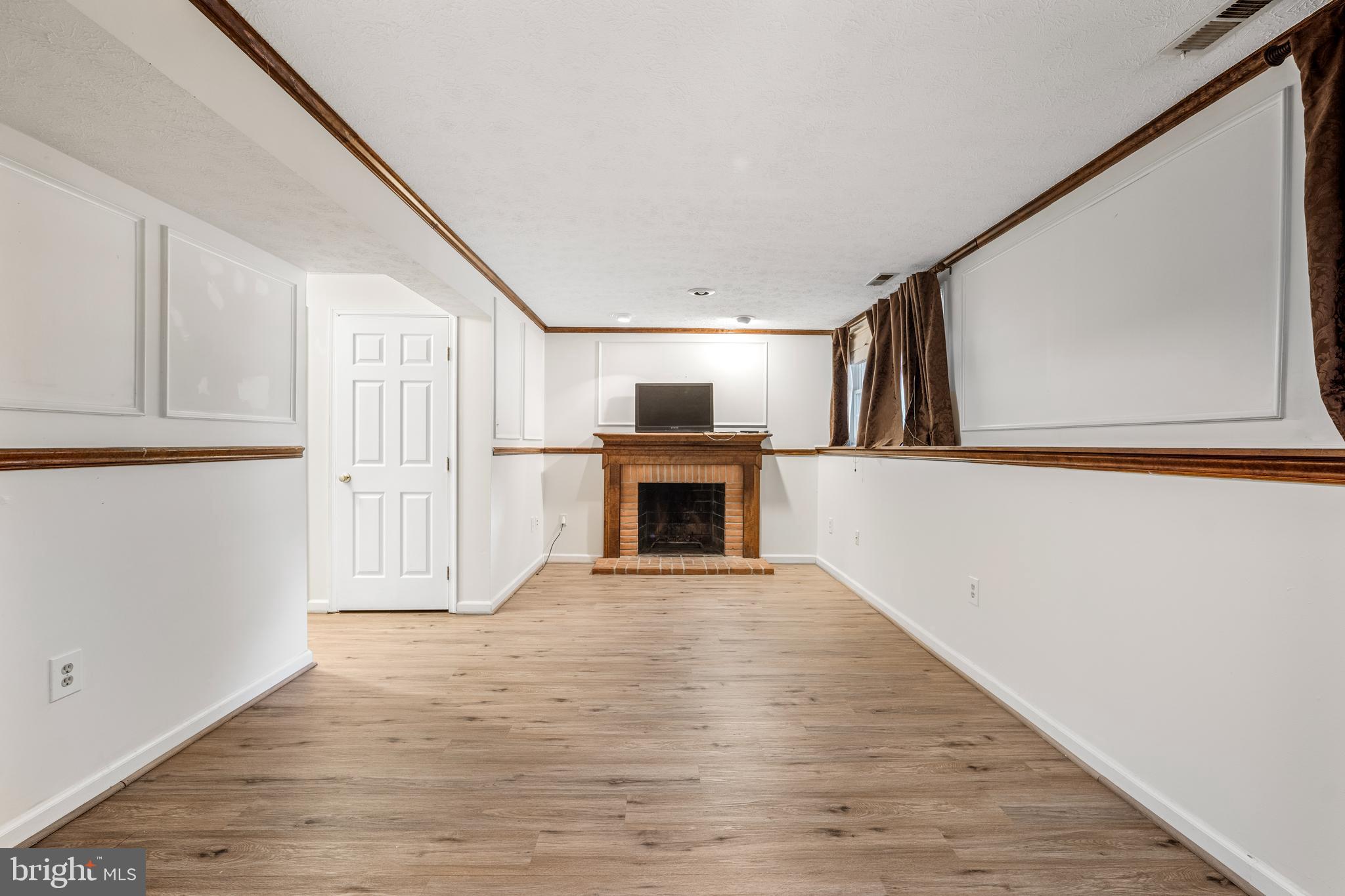 5522 April Journey, Unit 11 Columbia, MD 21044 - Photo 28 of 34 a view of a livingroom with a fireplace