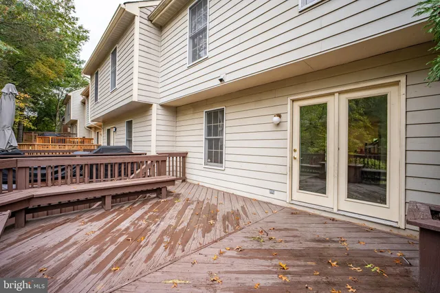 a view of a house with wooden deck