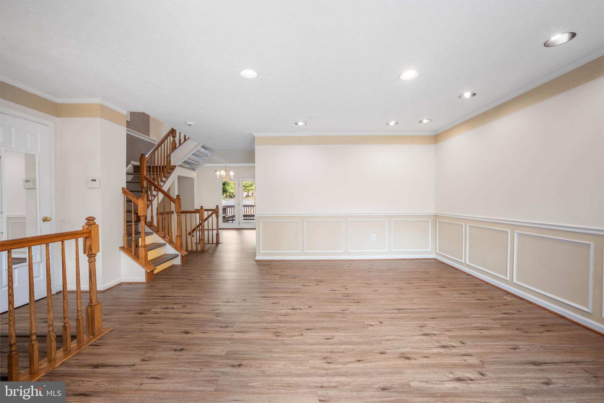 5522 April Journey, Unit 11 Columbia, MD 21044 - Photo 4 of 34 a view of an empty room with wooden floor and a window