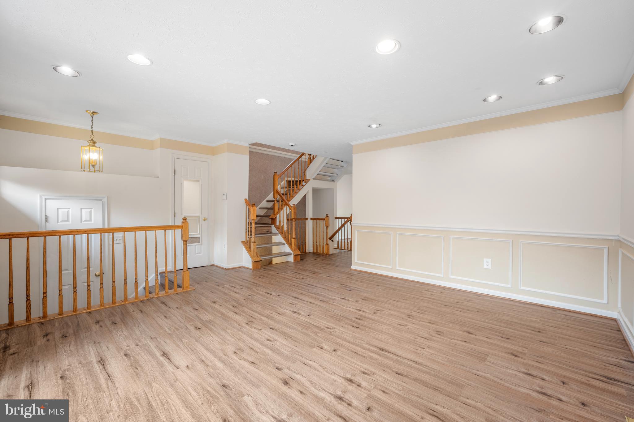 5522 April Journey, Unit 11 Columbia, MD 21044 - Photo 5 of 34 a view of an empty room with wooden floor