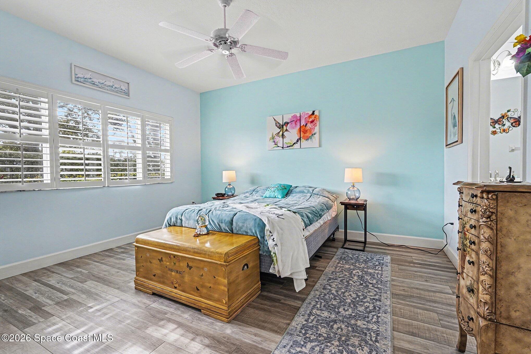 3051 Le Conte Street Melbourne, FL 32940 - Photo 11 of 32 a bedroom with a bed and a window