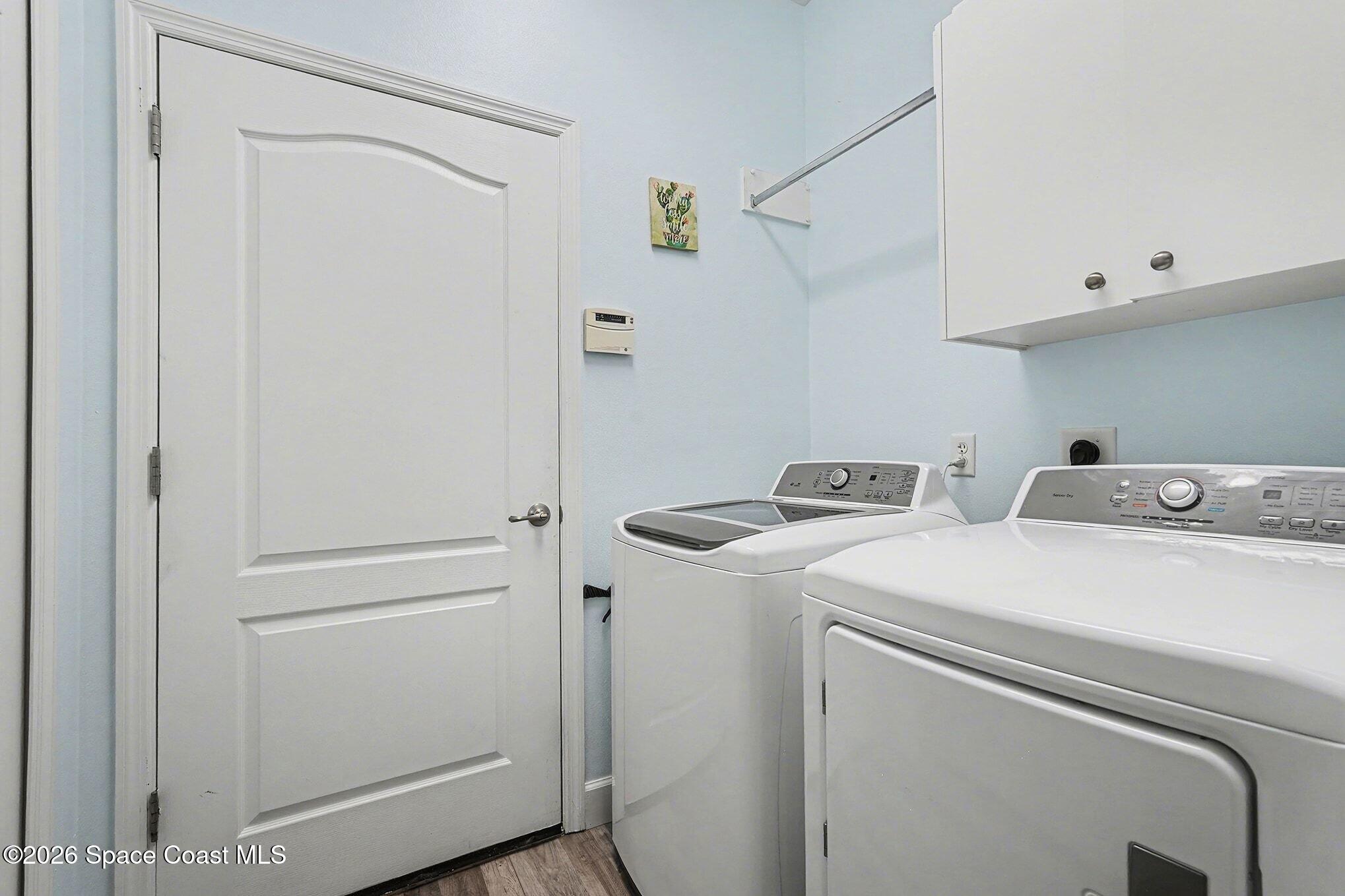 3051 Le Conte Street Melbourne, FL 32940 - Photo 20 of 32 a utility room with dryer and washer