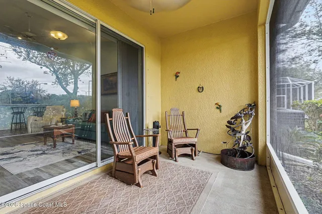 a view of a patio with a table and chairs