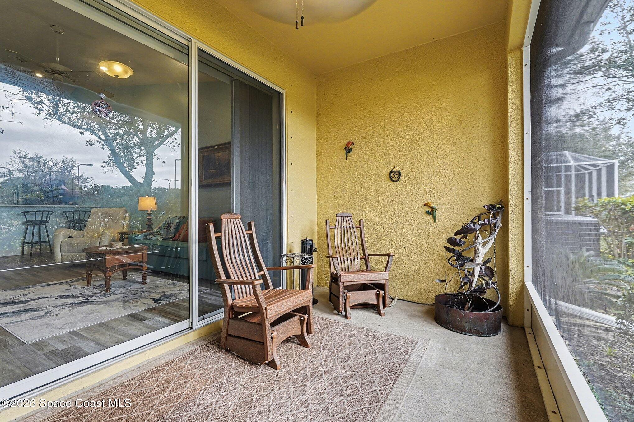 3051 Le Conte Street Melbourne, FL 32940 - Photo 21 of 32 a view of a patio with a table and chairs