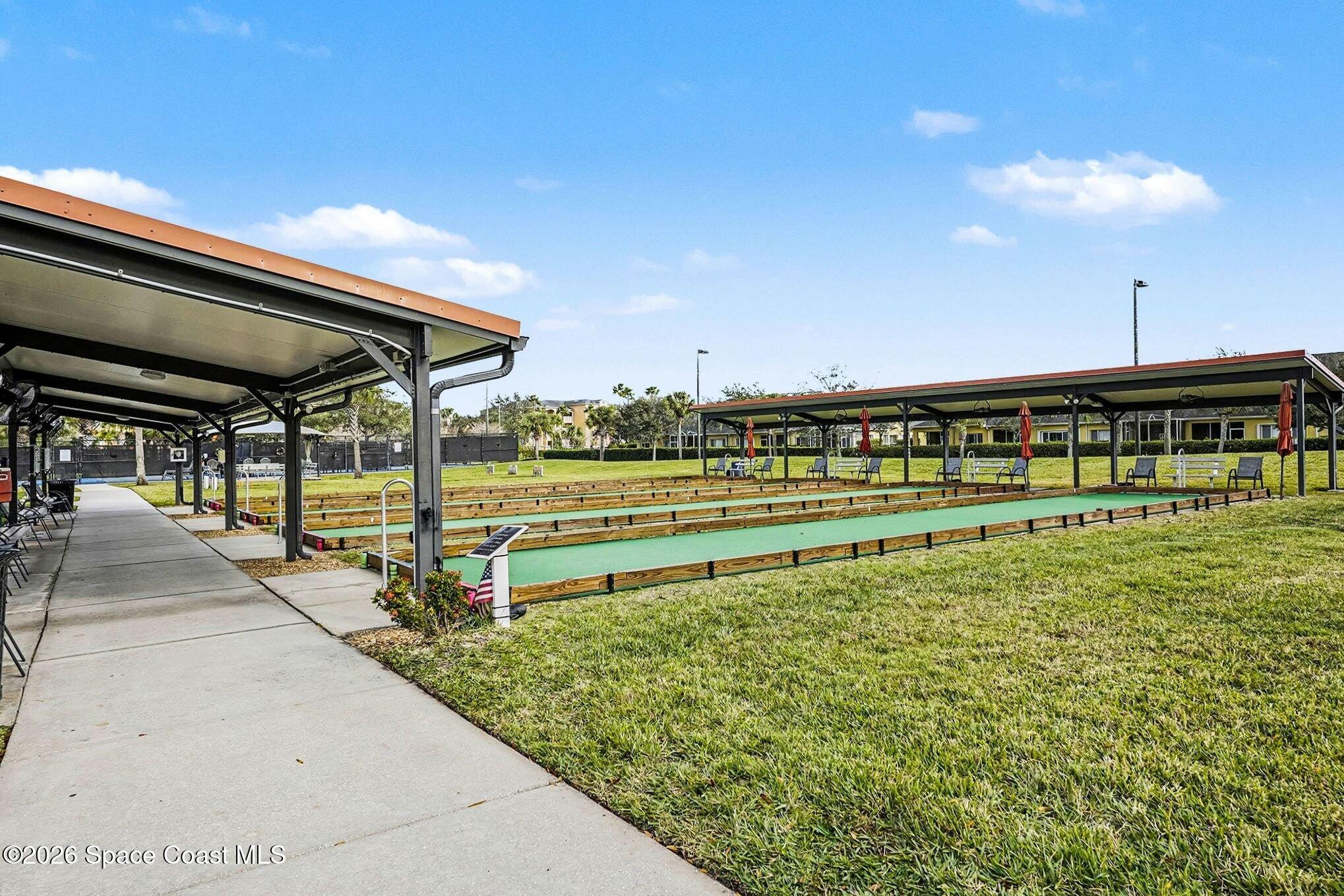 3051 Le Conte Street Melbourne, FL 32940 - Photo 26 of 32 a view of a swimming pool with a bench and trees