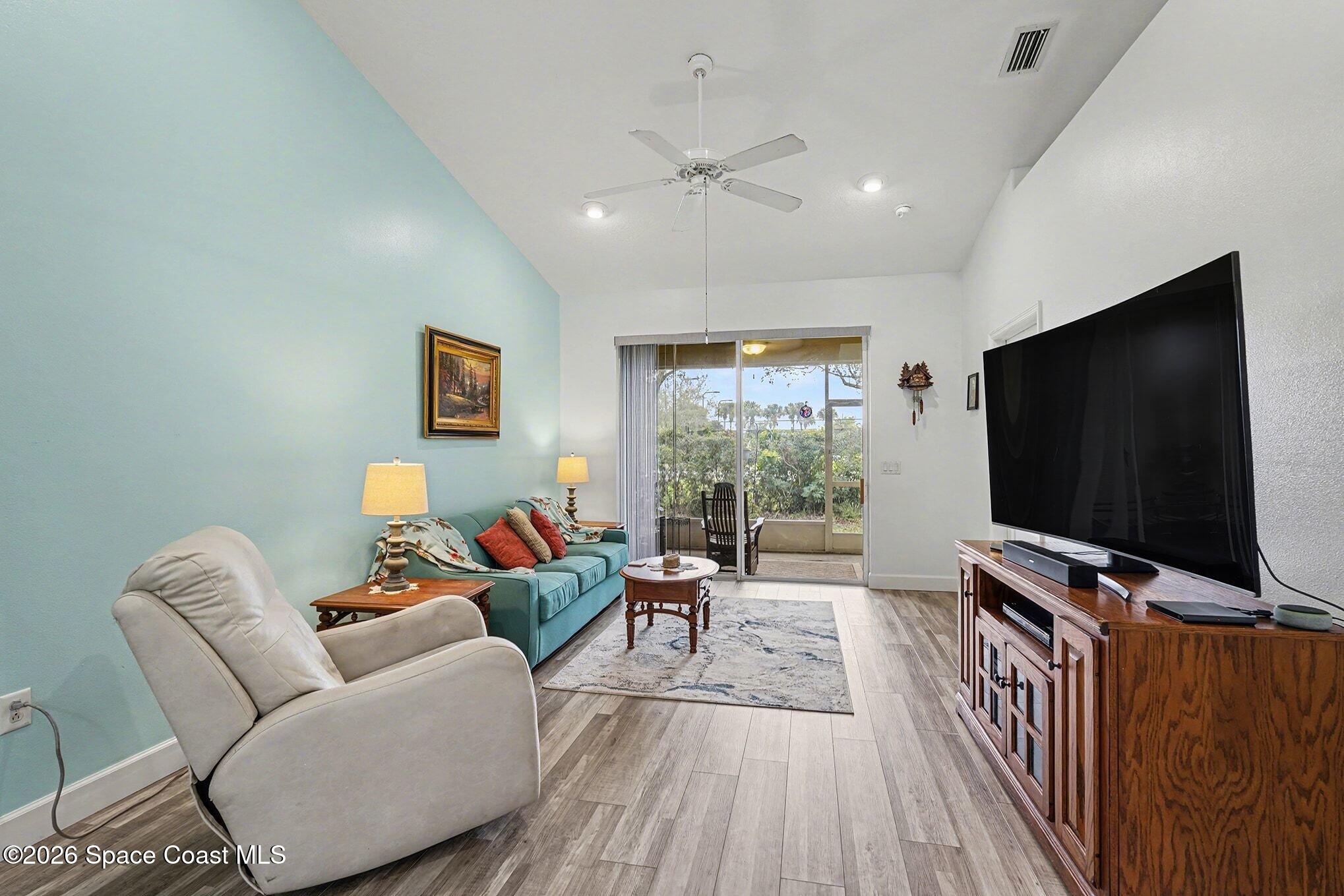 3051 Le Conte Street Melbourne, FL 32940 - Photo 6 of 32 a living room with furniture and a flat screen tv