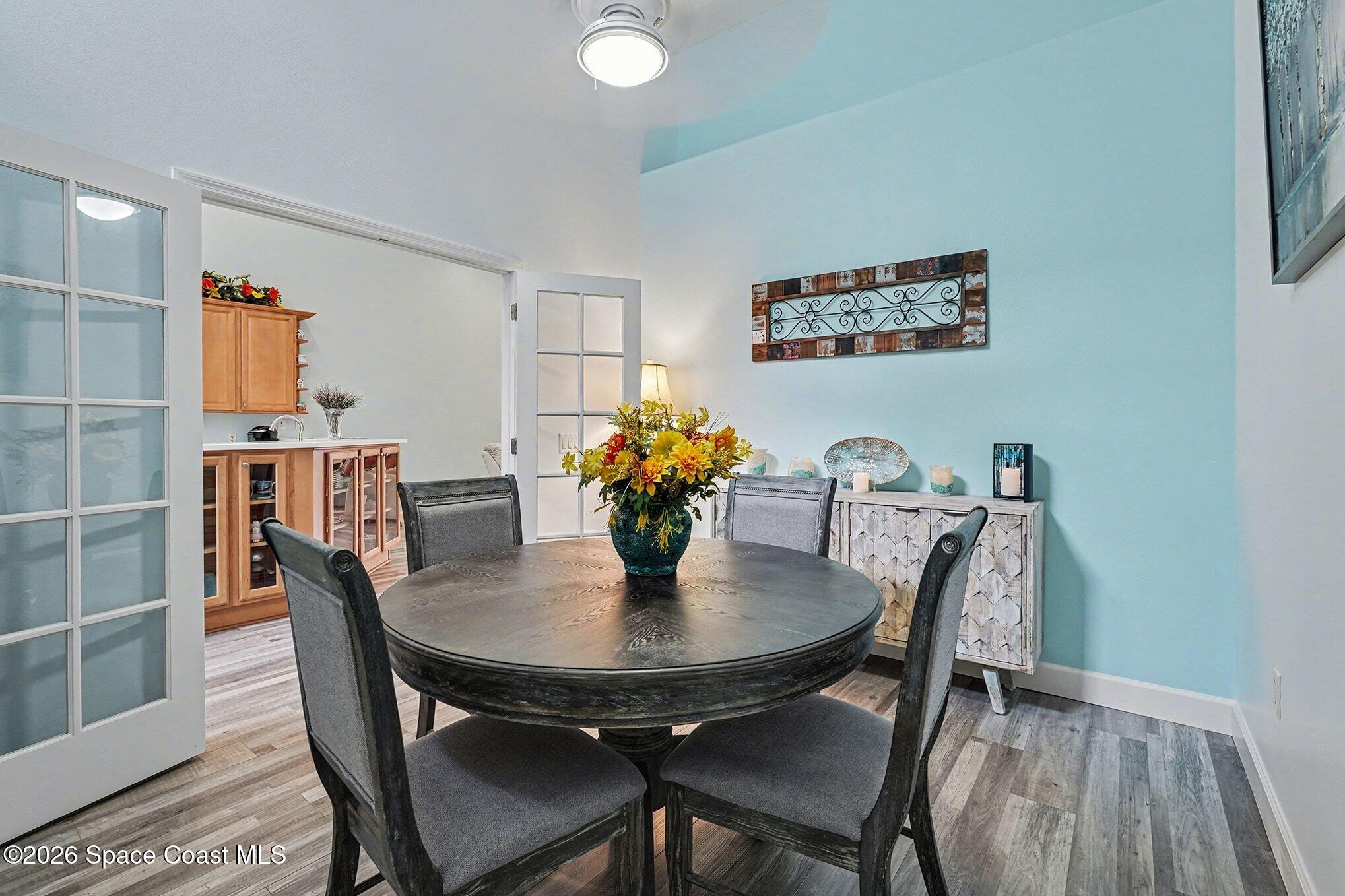 3051 Le Conte Street Melbourne, FL 32940 - Photo 10 of 32 a dining room with furniture and wooden floor