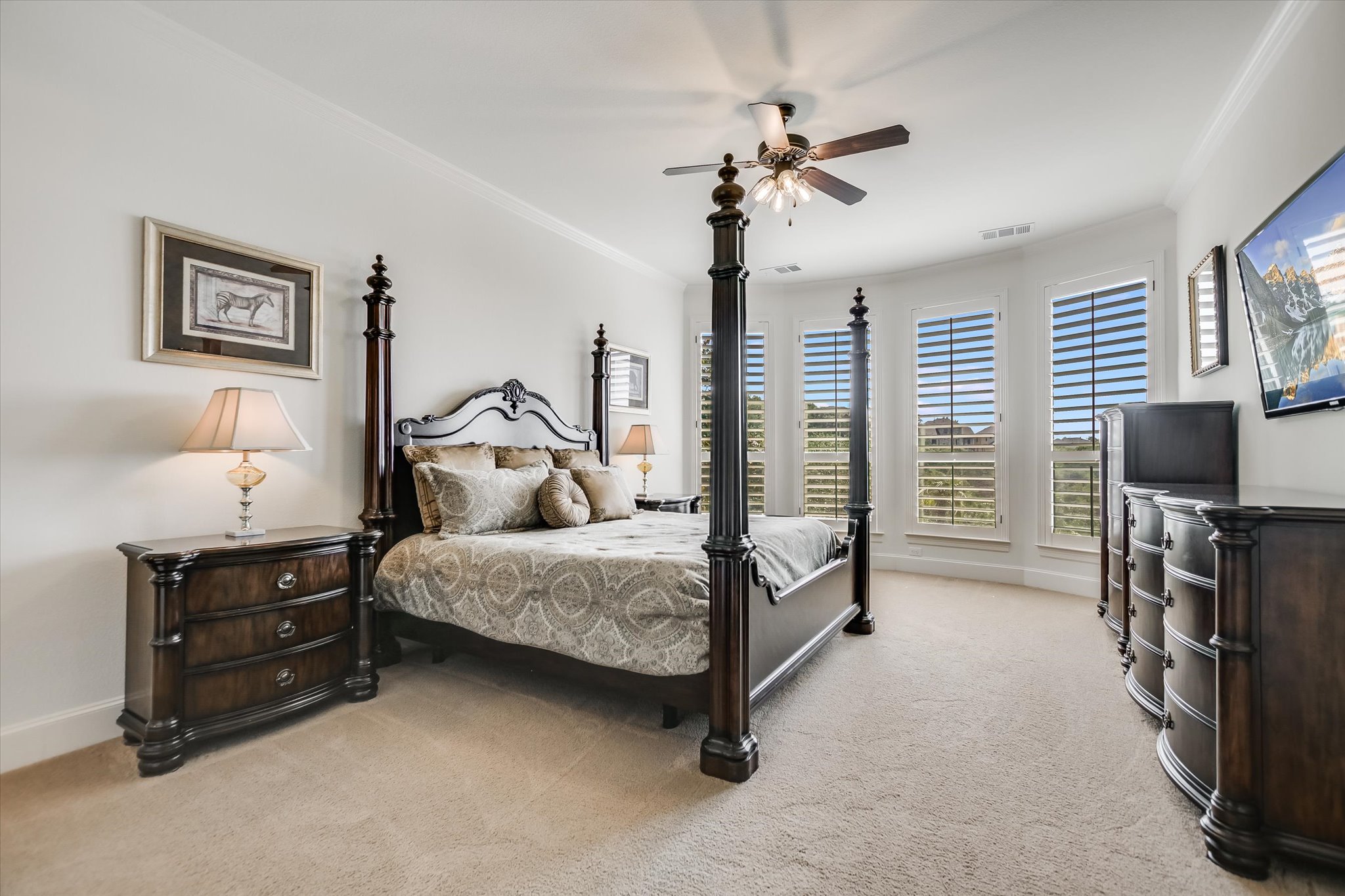 1016 SANTALUZ Path Austin, TX 78732 - Photo 11 of 40 The luxurious primary bedroom offers a private retreat with canyon views, exterior door access to balcony and pool area