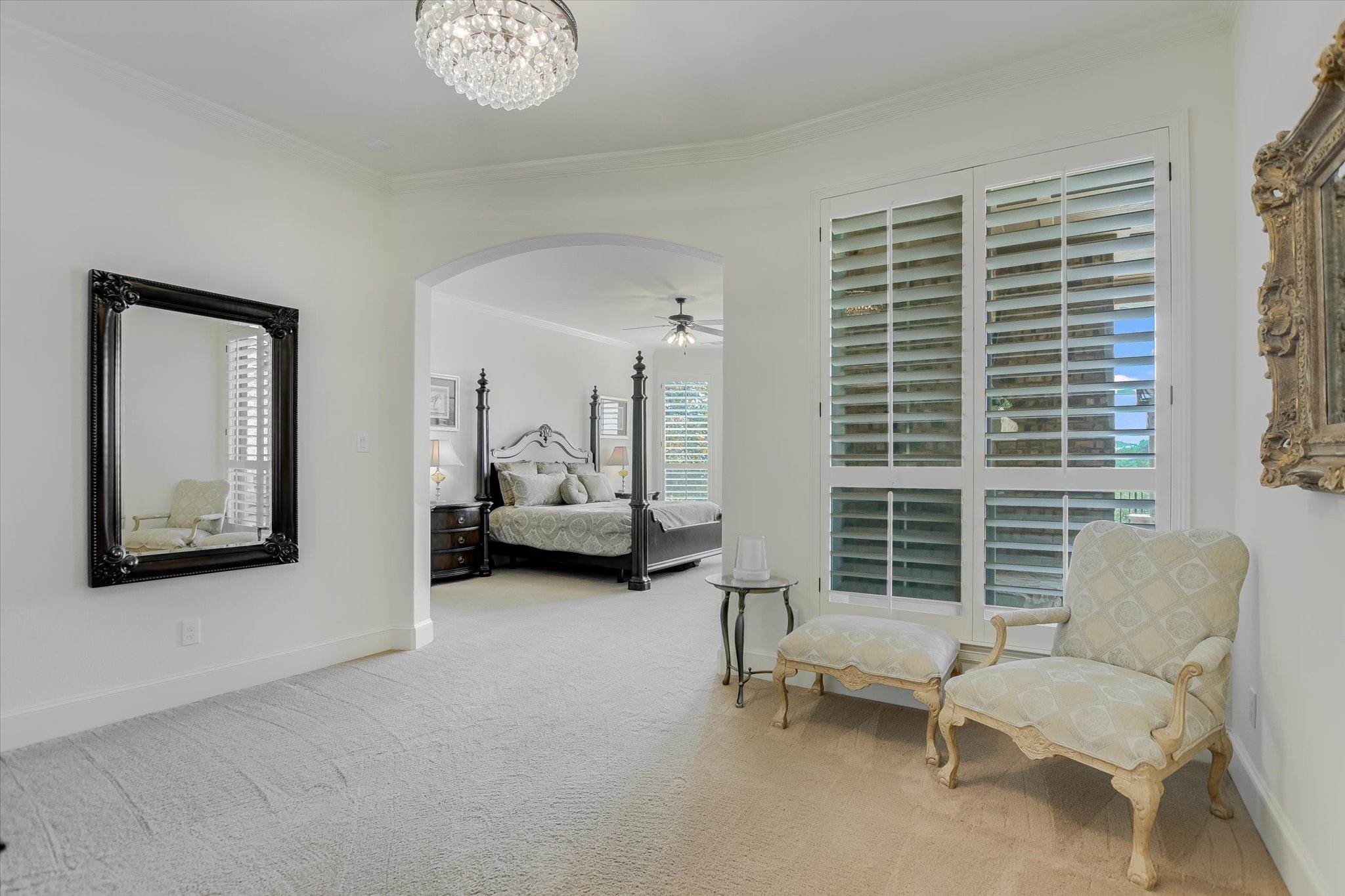 1016 SANTALUZ Path Austin, TX 78732 - Photo 12 of 40 Primary bedroom study/sitting area, w/exterior door to mail level balcony, arched walkways, and chandelier