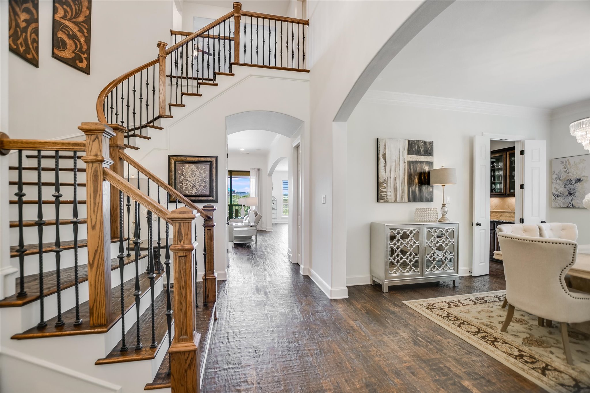 1016 SANTALUZ Path Austin, TX 78732 - Photo 18 of 40 Soaring ceilings and a wrought-iron staircase create a bright, airy first impression