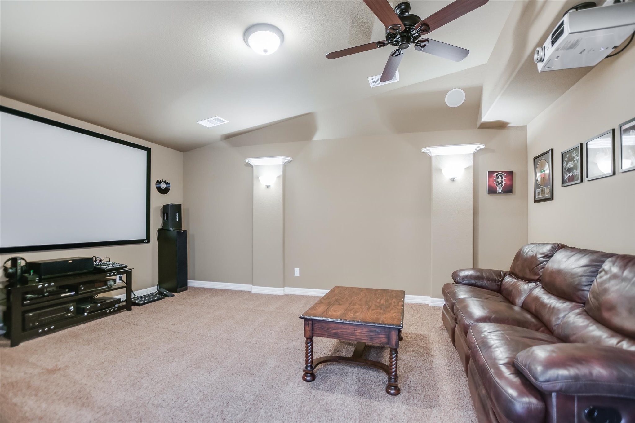 1016 SANTALUZ Path Austin, TX 78732 - Photo 23 of 40 The dedicated media room features built-in surround sound speakers, a 110" screen, and projector for the ultimate home theater experience