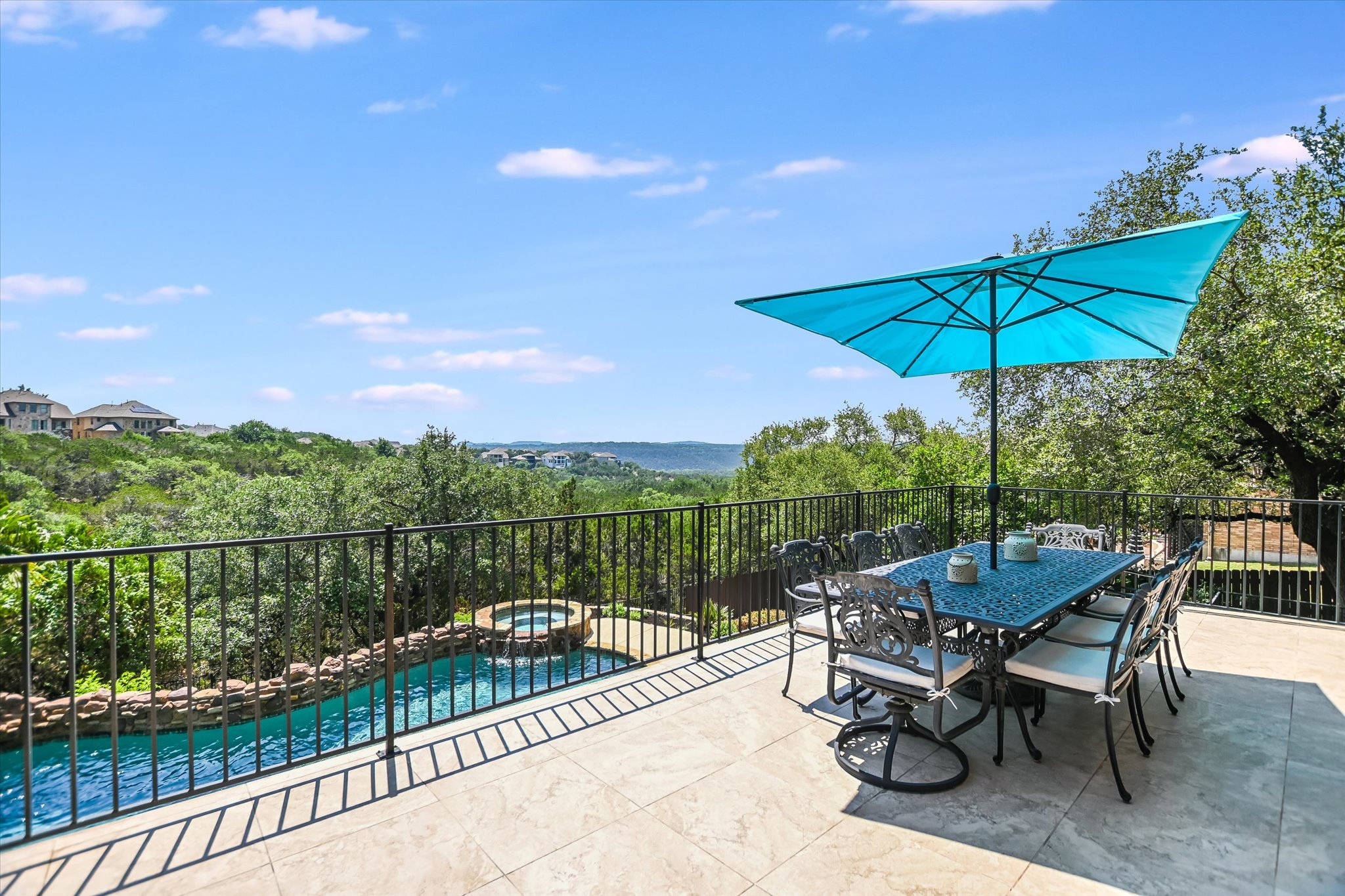 1016 SANTALUZ Path Austin, TX 78732 - Photo 8 of 40 a view of a chairs and table in the balcony