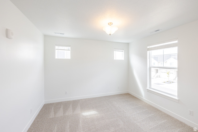 675 West 4500th South, Unit P302 Mapleton, UT 84664 - Photo 10 of 16 Bright room featuring neutral carpeting and white baseboards