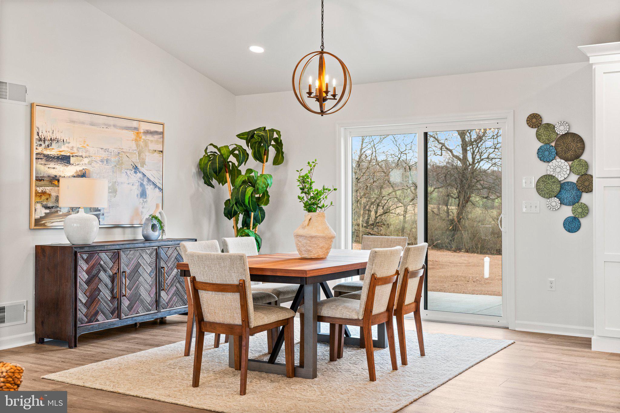 239 Brookview Drive Newport, PA 17074 - Photo 20 of 42 a dining room with furniture a potted plant and a chandelier