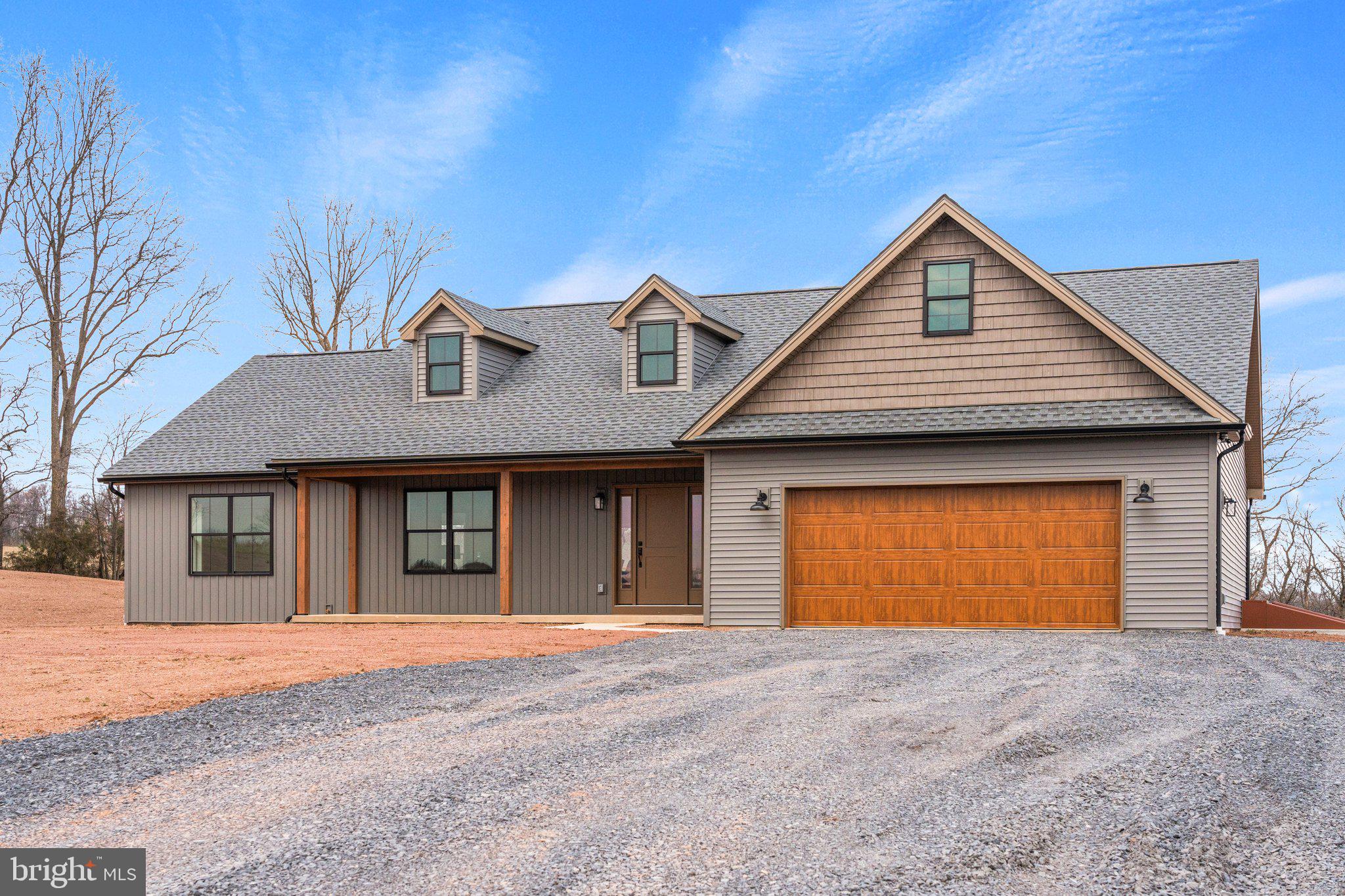 239 Brookview Drive Newport, PA 17074 - Photo 2 of 42 a front view of a house with a yard and garage